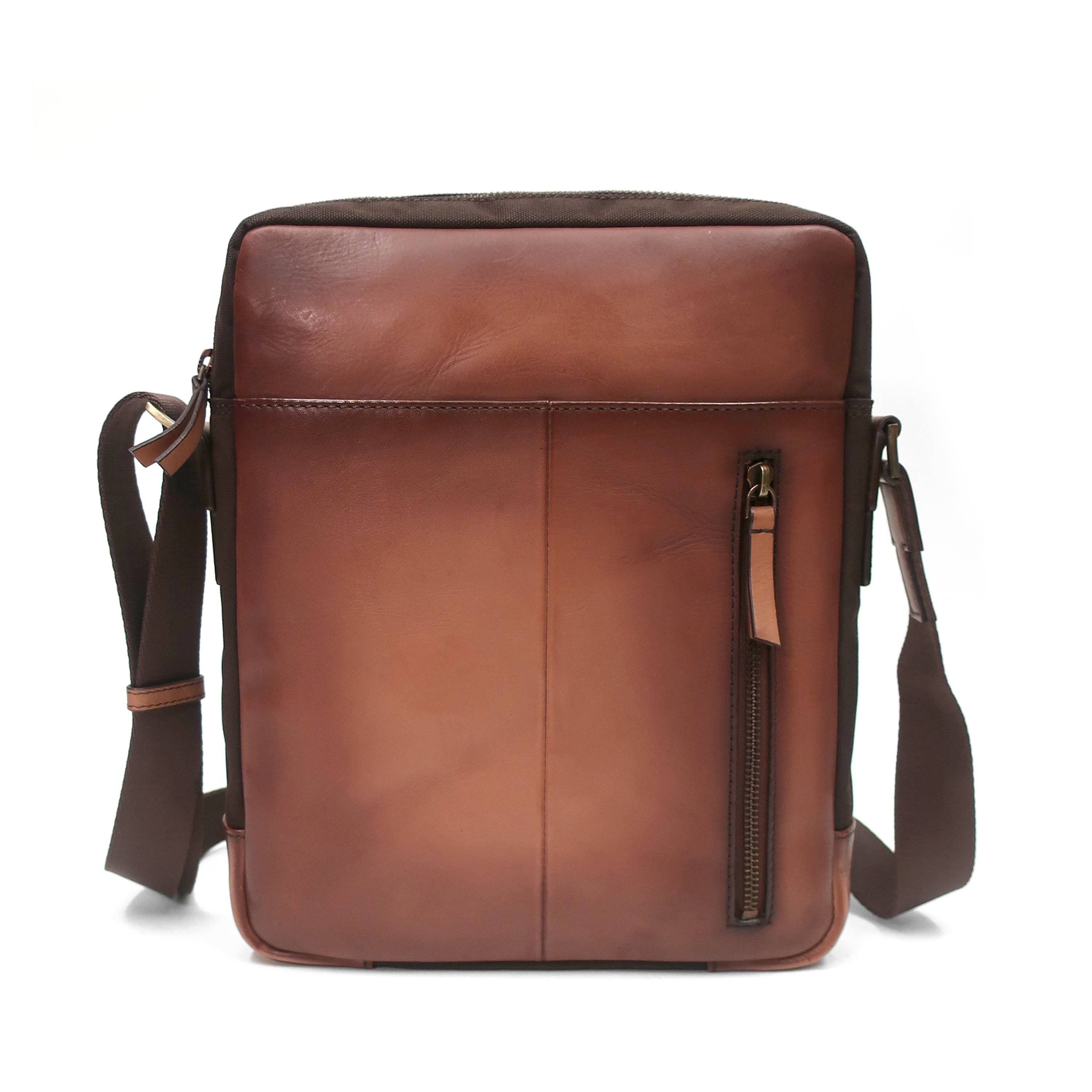 a brown leather messenger bag with a shoulder strap
