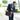 a man in a suit carrying Boconi Double Buckle canvas and leather laptop messenger bag