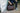 man holding leather duffel bag
