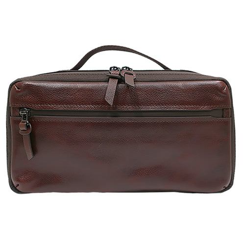 Garth Leather Expandable Travel Kit with reverse zipper in full grain brown leather, featuring top handle and front zip pocket for organized travel.