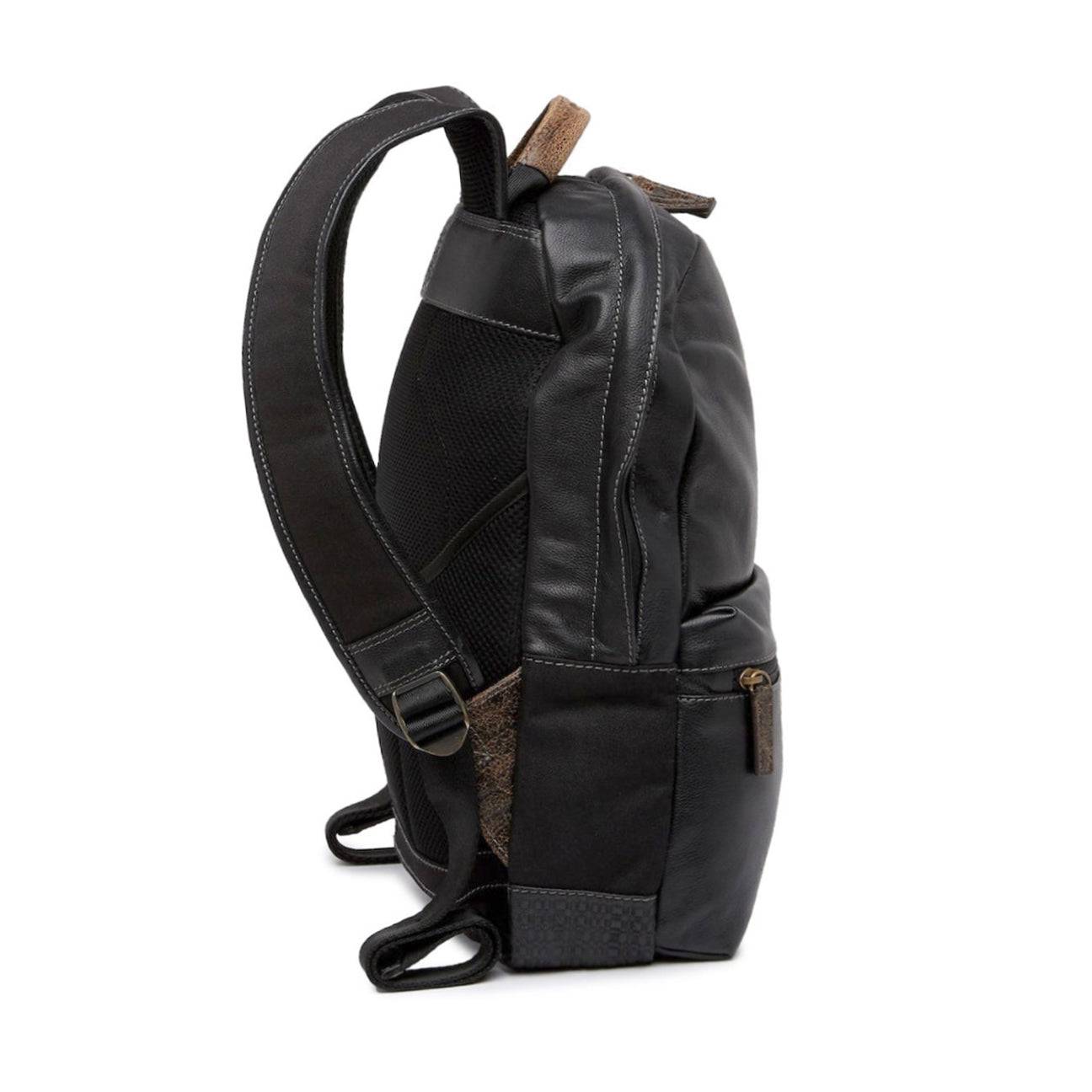 a black backpack with a brown strap